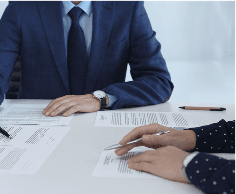 Business meeting with documents and pens