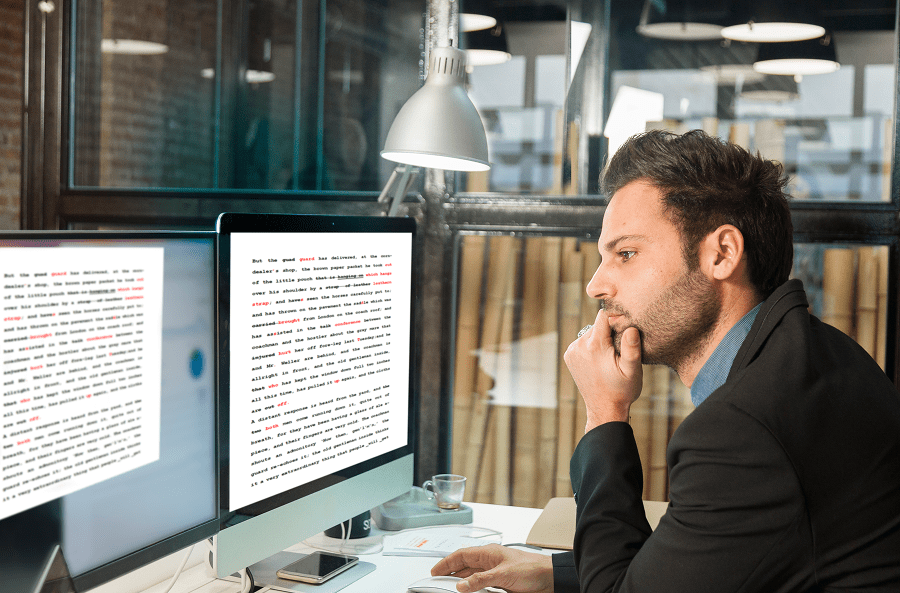 Man working at computer in office.