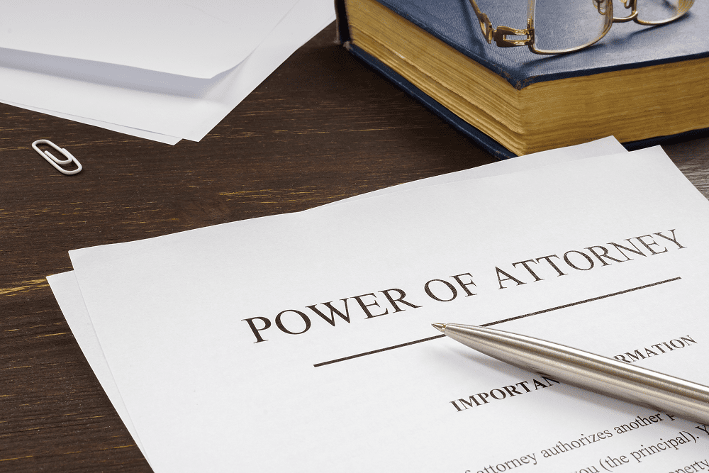 Power of attorney document on table
