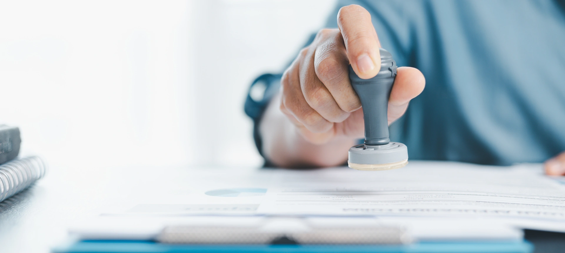 Person using a rubber stamp